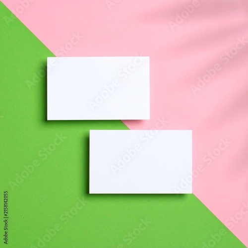 two blank cards on a pink and green background