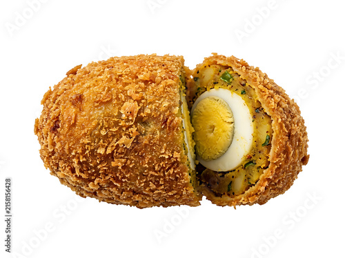 A delicious homemade nargisi kofta, a mughlai dish of minced meat covered eggs, sliced in half isolated on transparent background