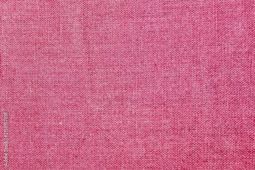 Close up macro shot of red linen fabric texture