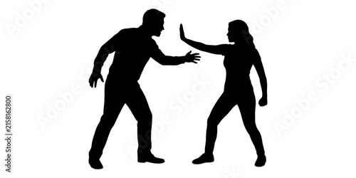 Bild auf Leinwand Silhouette of a man approaching a woman who is defensively holding up her hand t