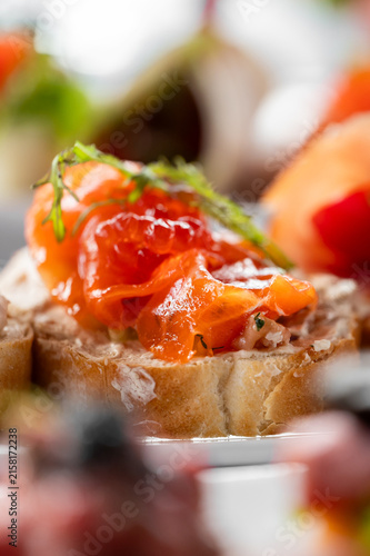 Cuadro en lienzo Smoked salmon crostini appetizer with cream cheese on sliced baguette, garnished with fresh dill