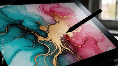 Digital tablet displays abstract art with teal pink gold colors. Stylus touches screen creating artwork. Close-up view of artist making digital painting on display.
