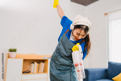 Professional Cleaner Efficiently Vacuuming Modern Home Promoting Domestic Service Productivity
