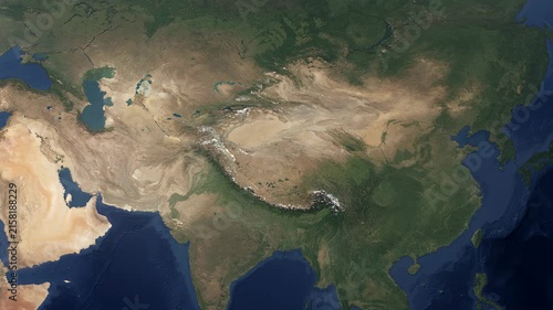Realistic satellite map animation of Xinjiang China with geographic region highlighted and smooth camera zoom over desert terrain 