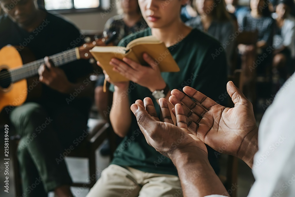 Obraz premium People gathered in a group session with one person praying and another reading from a book