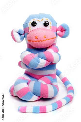 Monkey sock toy isolated on white background
