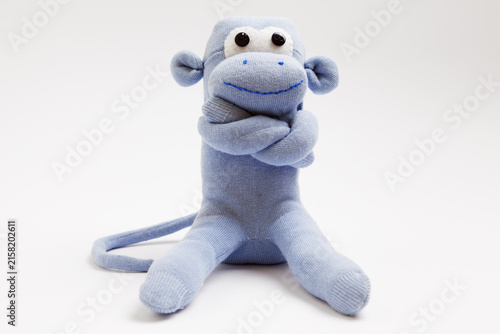 Monkey sock toy isolated on white background