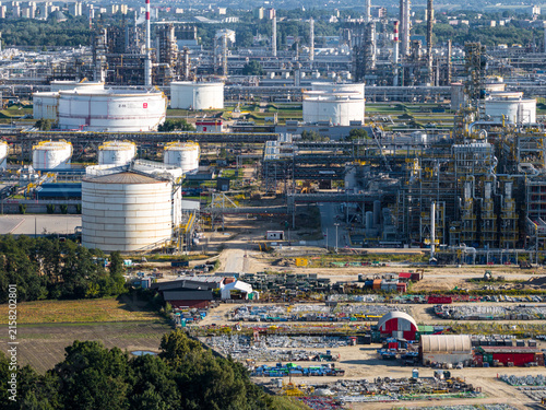 Aerial view of PKN Orlen refinery featuring large storage tanks, complex industrial piping, and processing facilities in Plock, Masovian Voivodeship, Poland.