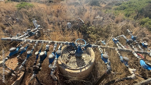 Water supply system and water intake infrastructure in Greece, featuring pipelines and technical facilities used for water collection and distribution. Industrial infrastructure surrounded by the Gree