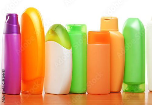 Row of cosmetics isolated on white background. Close up