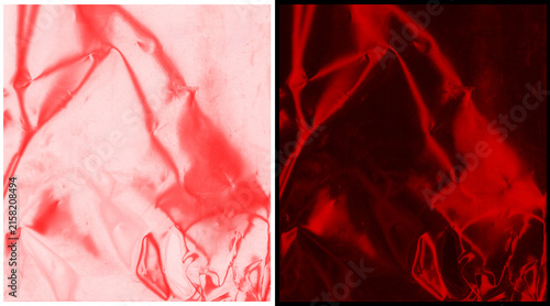 Red crumpled plastic texture background, abstract wrinkled foil surface, vibrant ruby metallic paper overlay for graphic design