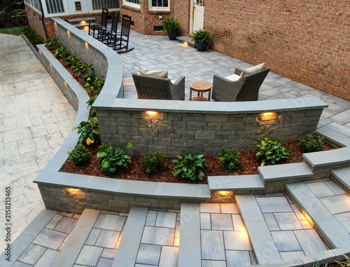 Konstfotografi Elevated Wide Angle View Of Custom Stone Patio Retaining Wall And Tiered Stairs