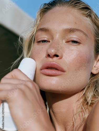 Woman applying beauty cream