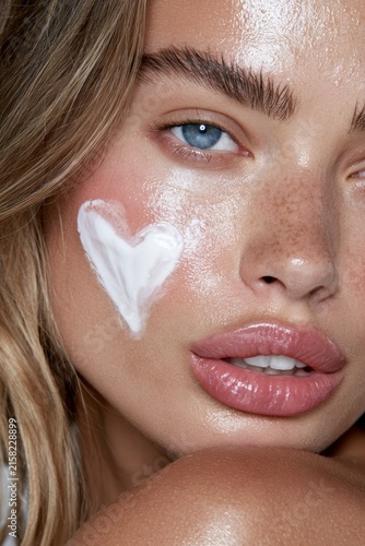 Model with Heart-Shaped Cream