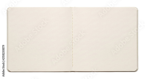 Fotografie Open blank notebook with cream pages and stitched binding, ready for writing