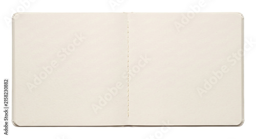 Obraz na plátně Open blank notebook with cream pages and stitched binding on a white background