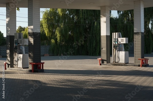 
Gas station fuel dispensers with diesel and gasoline pumps in outdoor service areas
