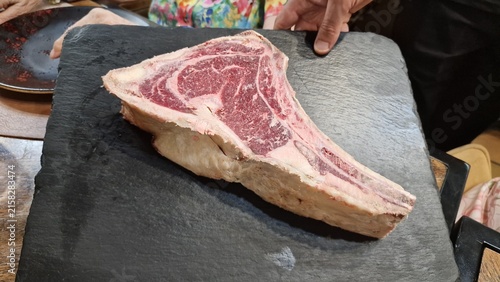 Typical dish of Spain and Argentina: raw ox ribeye steak for grilling