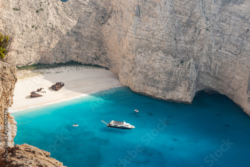 Quadro su tela View of Navagio Beach from a clifftop viewpoint in Zakynthos, Greece, with the remains of the MV Panagiotis shipwreck on the beach below