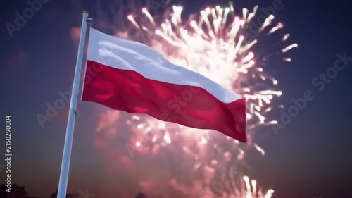 National flag of Poland waving against festive fireworks at night