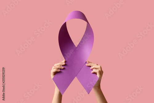 Canvastavla Hands holding a purple awareness ribbon, a symbol of support for various causes,