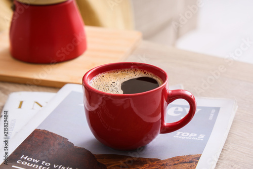 Red ceramic coffee mug fill...