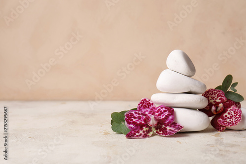Stacked white spa stones wi...