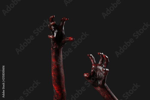 Obraz na plátně Hands of zombie on black background. Halloween celebration