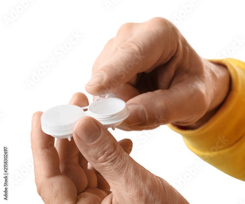 Konstfotografi Male hands with contact lens and case on white background