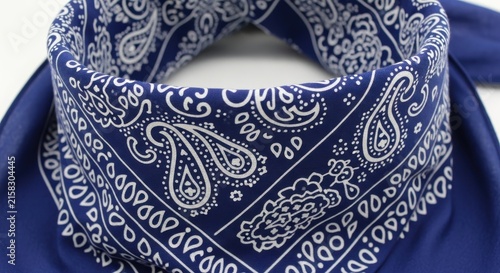Blue paisley pattern bandana folded neatly on white.