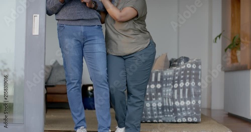 Sliding door opening, African American couple stepping onto deck, holding blue mug, sharing morning
