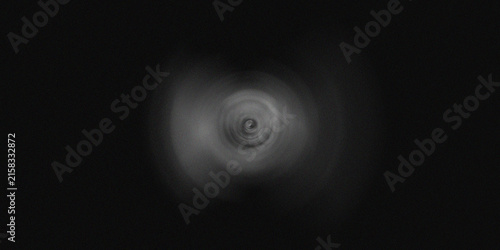 Fotografie Abstract circular motion blur effect creates a subtle monochrome background