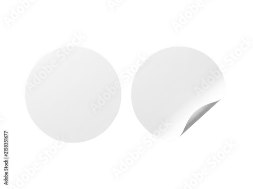 Blank white round paper stickers with curled corner as isolated on transparent background