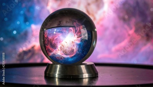 Illuminated Crystal Orb Reflecting Vibrant Cosmic Nebula on Metallic Stand