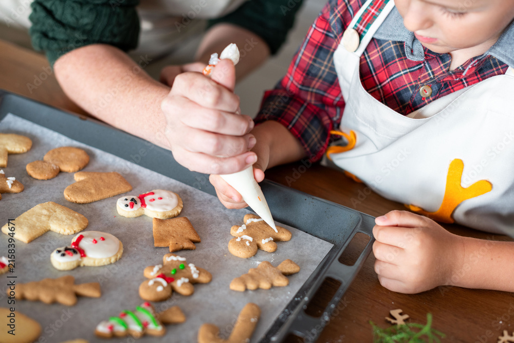 Fototapeta premium Family baking holiday cookies together.