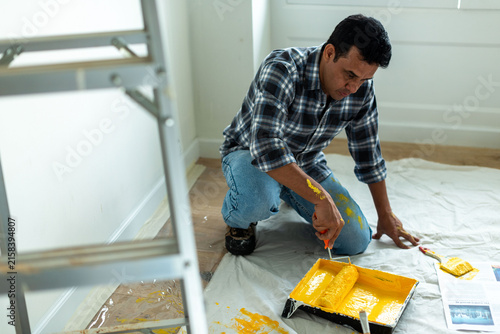 Photography Man painting room interior yellow