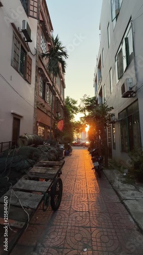Vertical wide shot of Narrow Vietnamese Alley at Sunset. Empty Urban Asian Street 