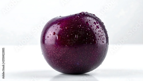 Close-up of a glossy purple blackberry fruit.