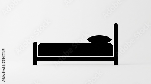 Black silhouette of a bed against a light gray background