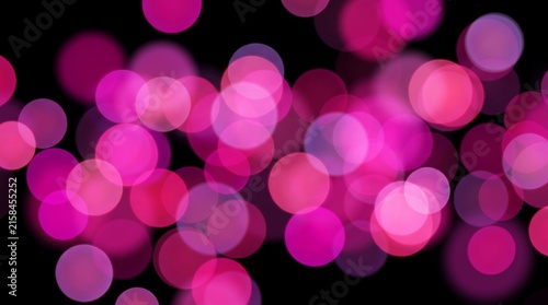 Glowing pink and purple bokeh light circles scattered on black background for festive design.