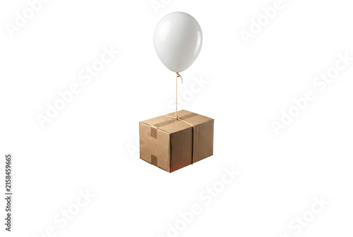 Bild auf Leinwand Cardboard parcel floating suspended by a single white balloon