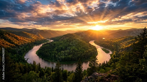 Golden hour aerial view of winding river valley.