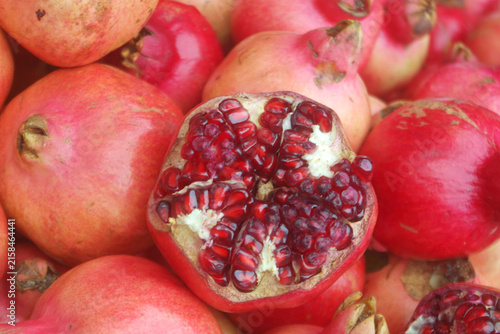 Fresh ripe pomegranate fruits close up as background	