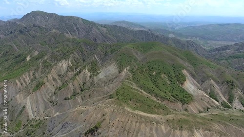 Eroded valley and rugged highlands in Turkey reveal gullies beside forested slopes.