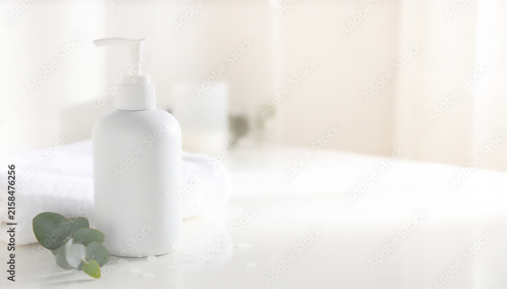Fototapeta premium Minimal White Pump Bottle with Towels and Eucalyptus, Skincare Packaging Mockup with Copy Space