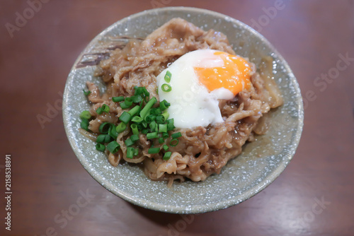 Rice topped with stir fried pork or stir fried beef and egg or Japanese food or Korean food or Beef Rice Bowl , Gyudon