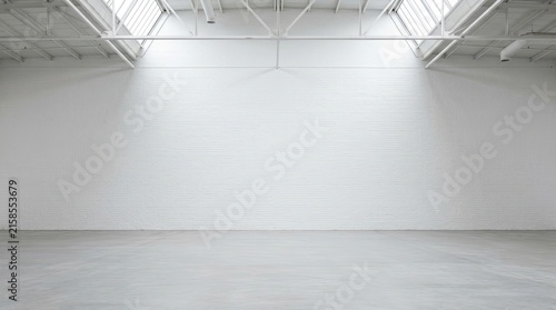 Large Empty Industrial Warehouse with White Brick Walls and Concrete Floor