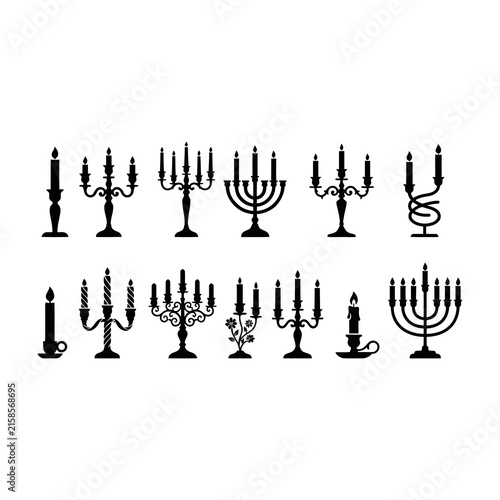 Foto Black silhouettes of various menorahs and candelabras on white background
