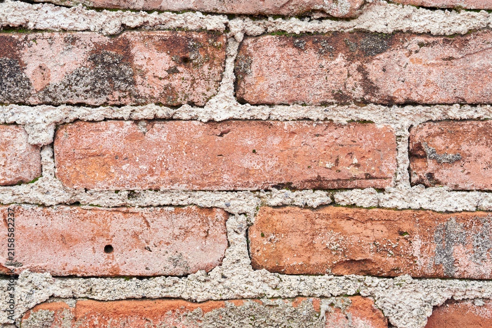 Obraz premium Pared de ladrillo antiguo, fondo de textura rústica y envejecida