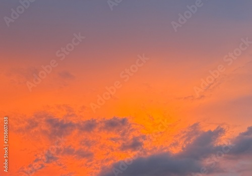 Quadro su tela Dramatic orange and purple sunset sky background with soft clouds